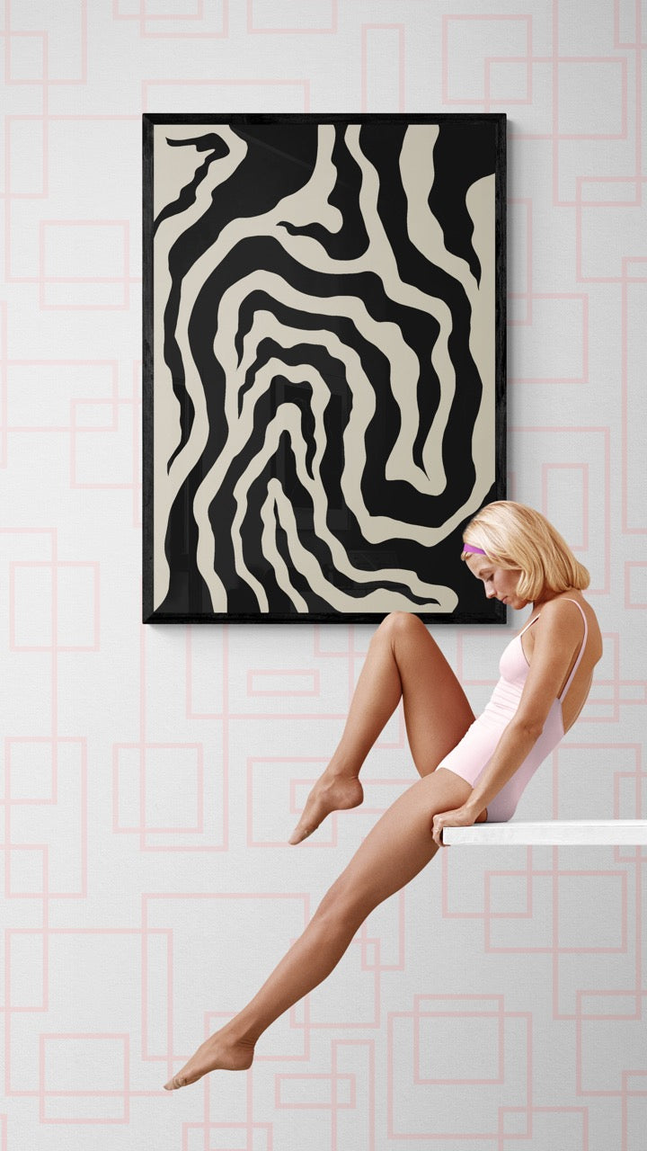 Woman sitting on a white ledge with abstract art on the wall