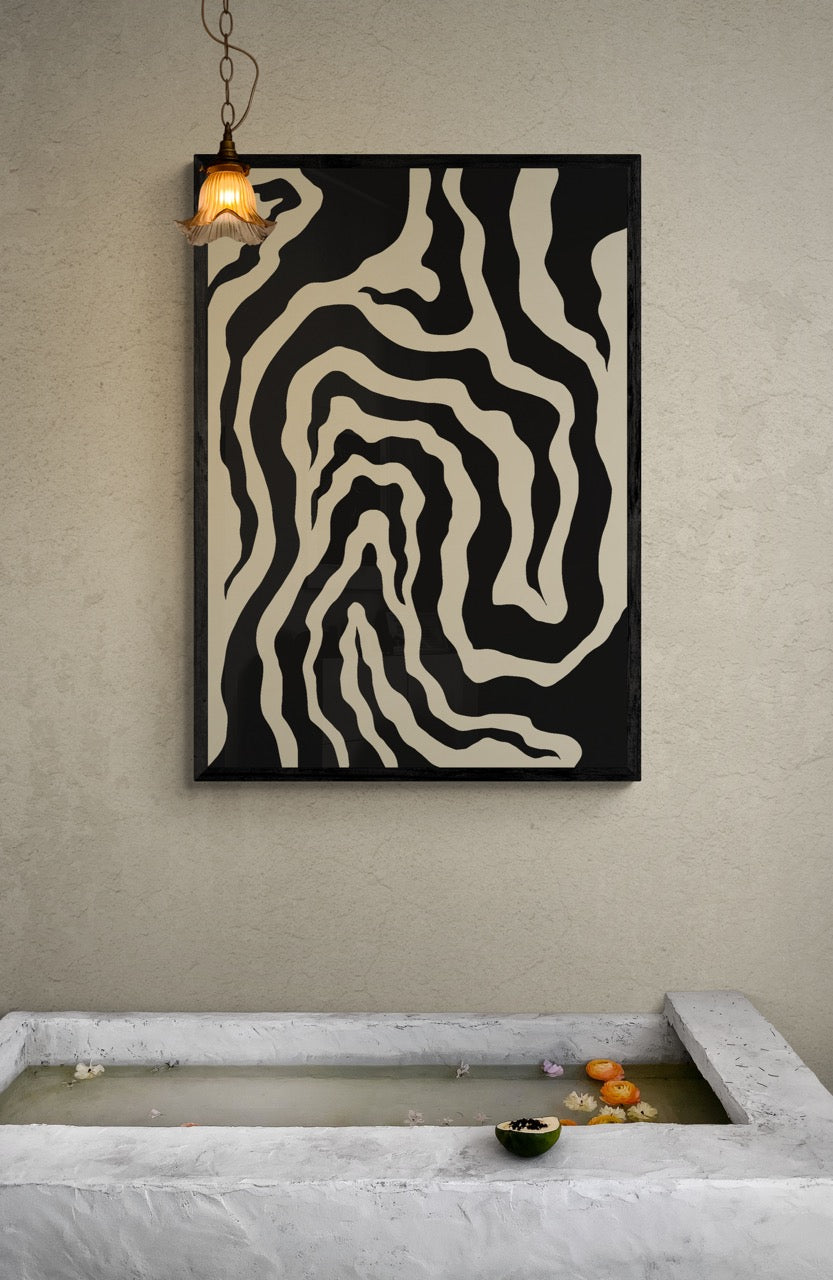 Abstract wall art with wavy patterns on a neutral wall above a water feature.